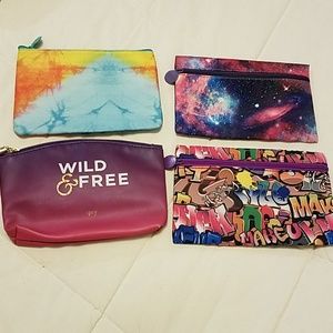4 multicolored makeup bags